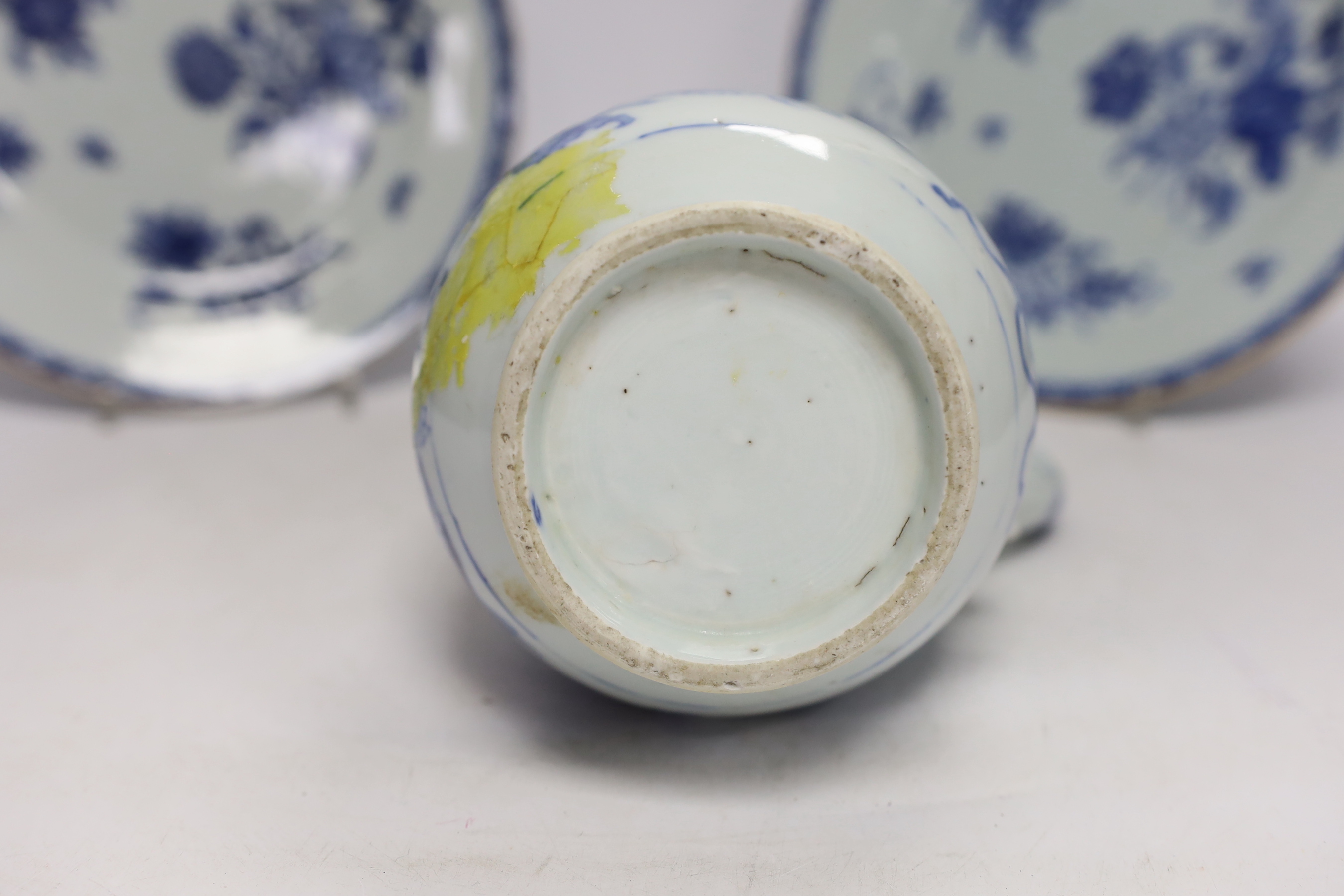 A Chinese 18th century reticulated double walled tea bowl and saucer, two blue and white plates and a jug (5)